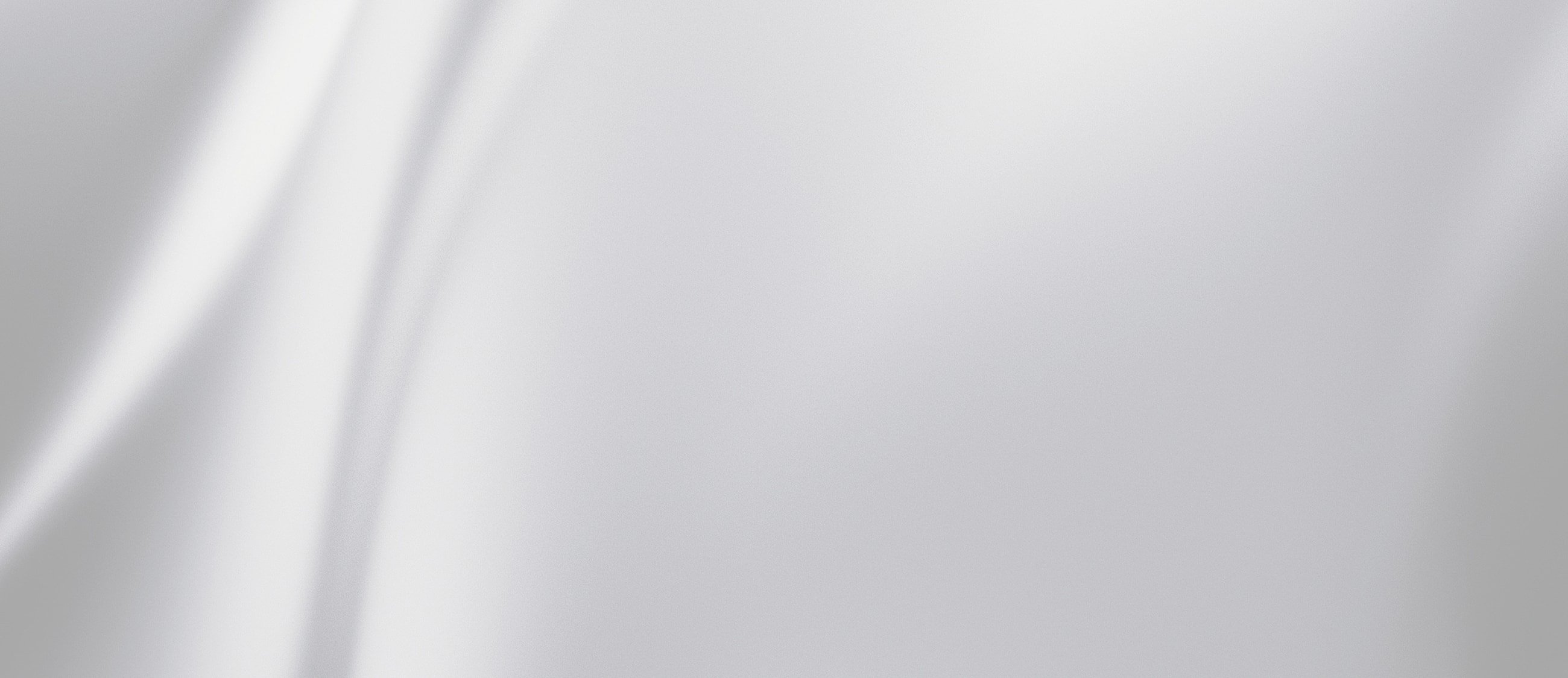 Woman smiling, wearing elegant black attire.