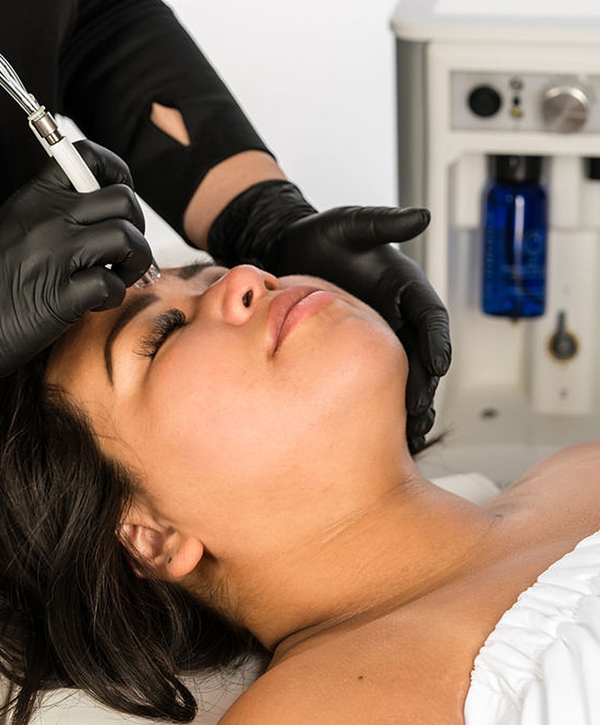 Medical professional preparing patient for procedure.