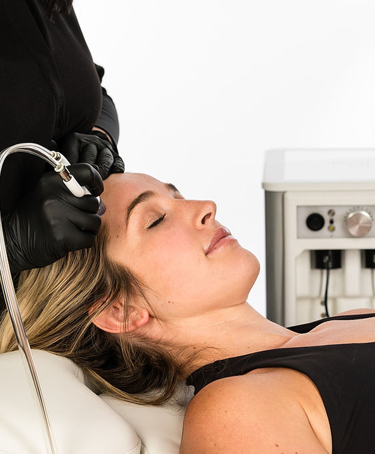 Black and white portrait of a woman in shirt.