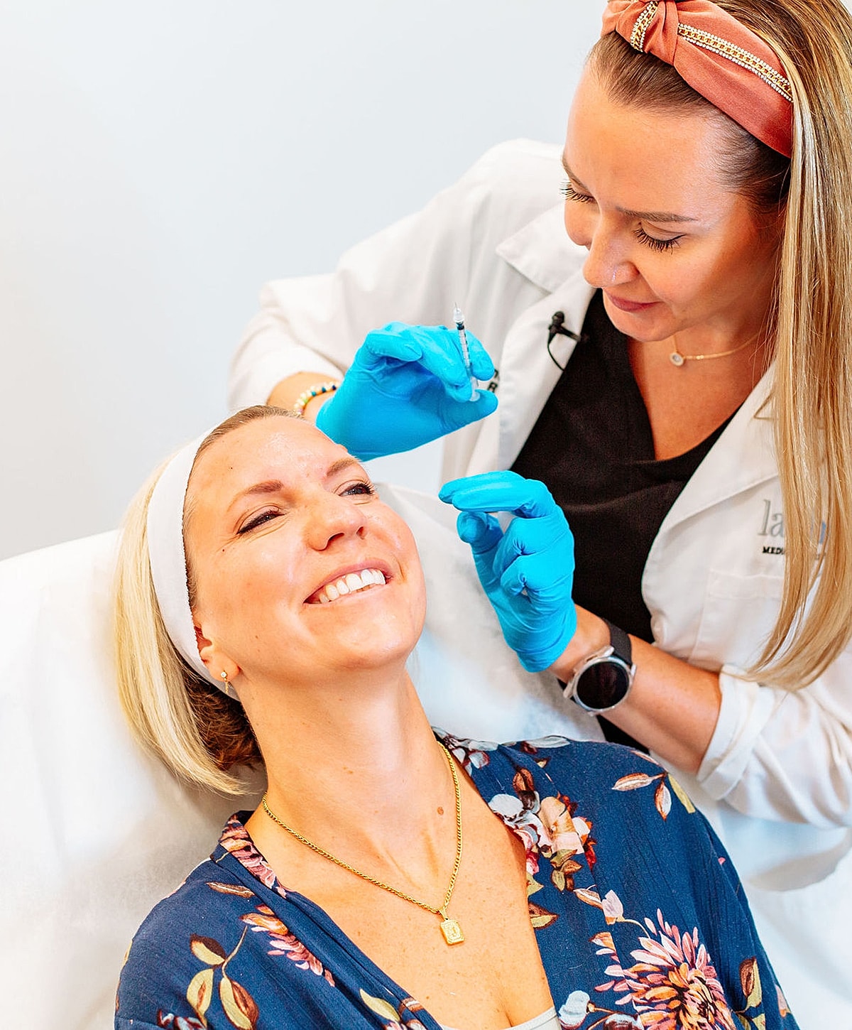Medical professional preparing patient for procedure.