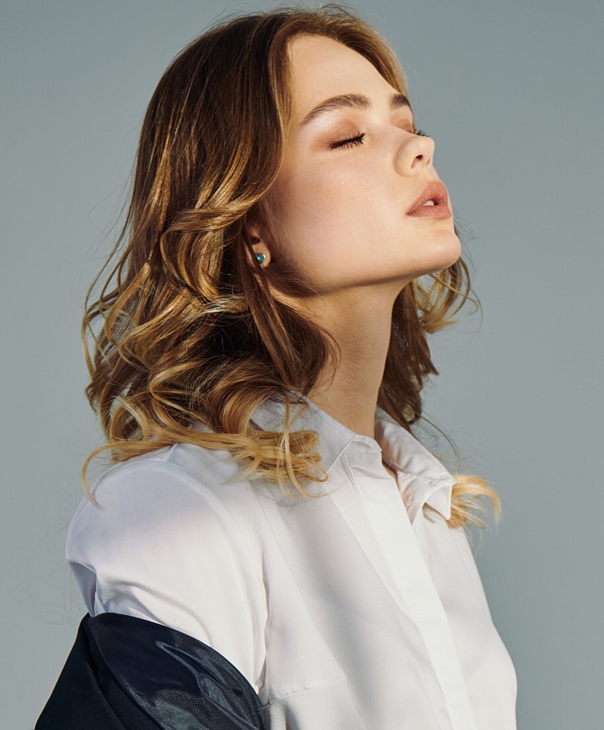 Woman showcasing skincare and beauty with JUVÉDERM.