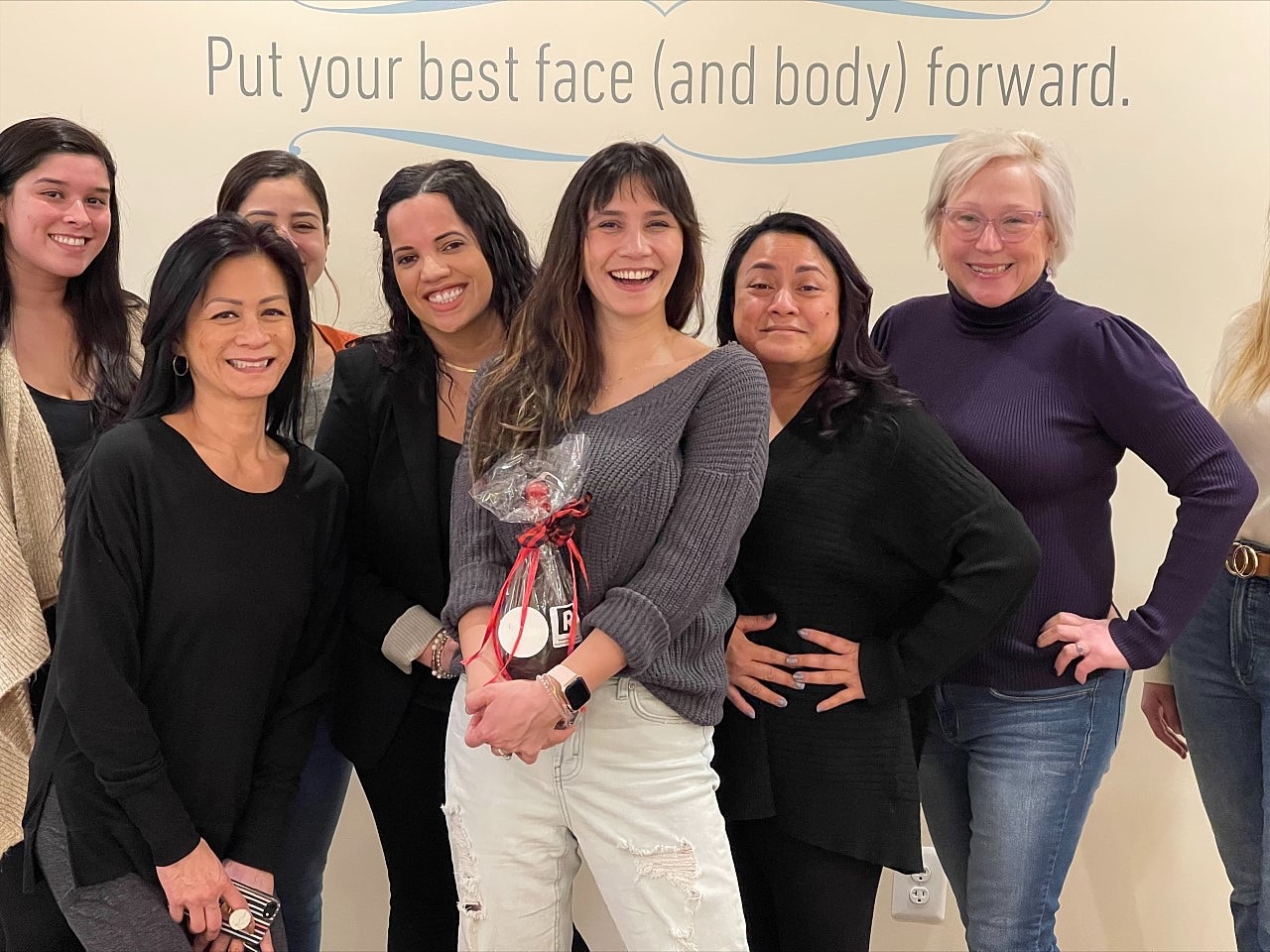 Group of women smiling in a friendly gathering.