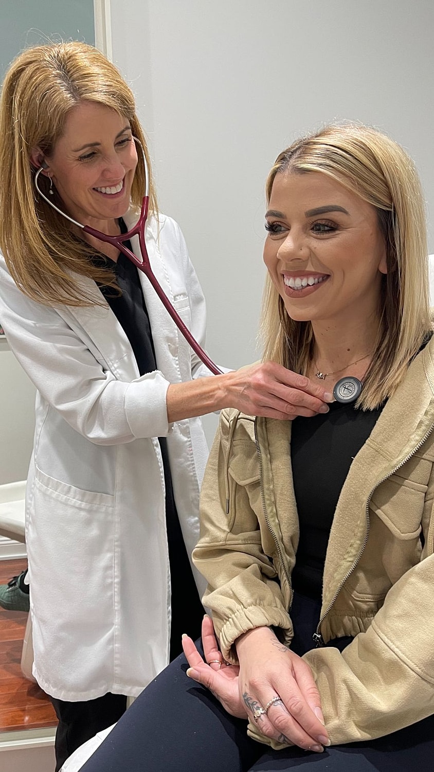 Black and white portrait of a woman in shirt.