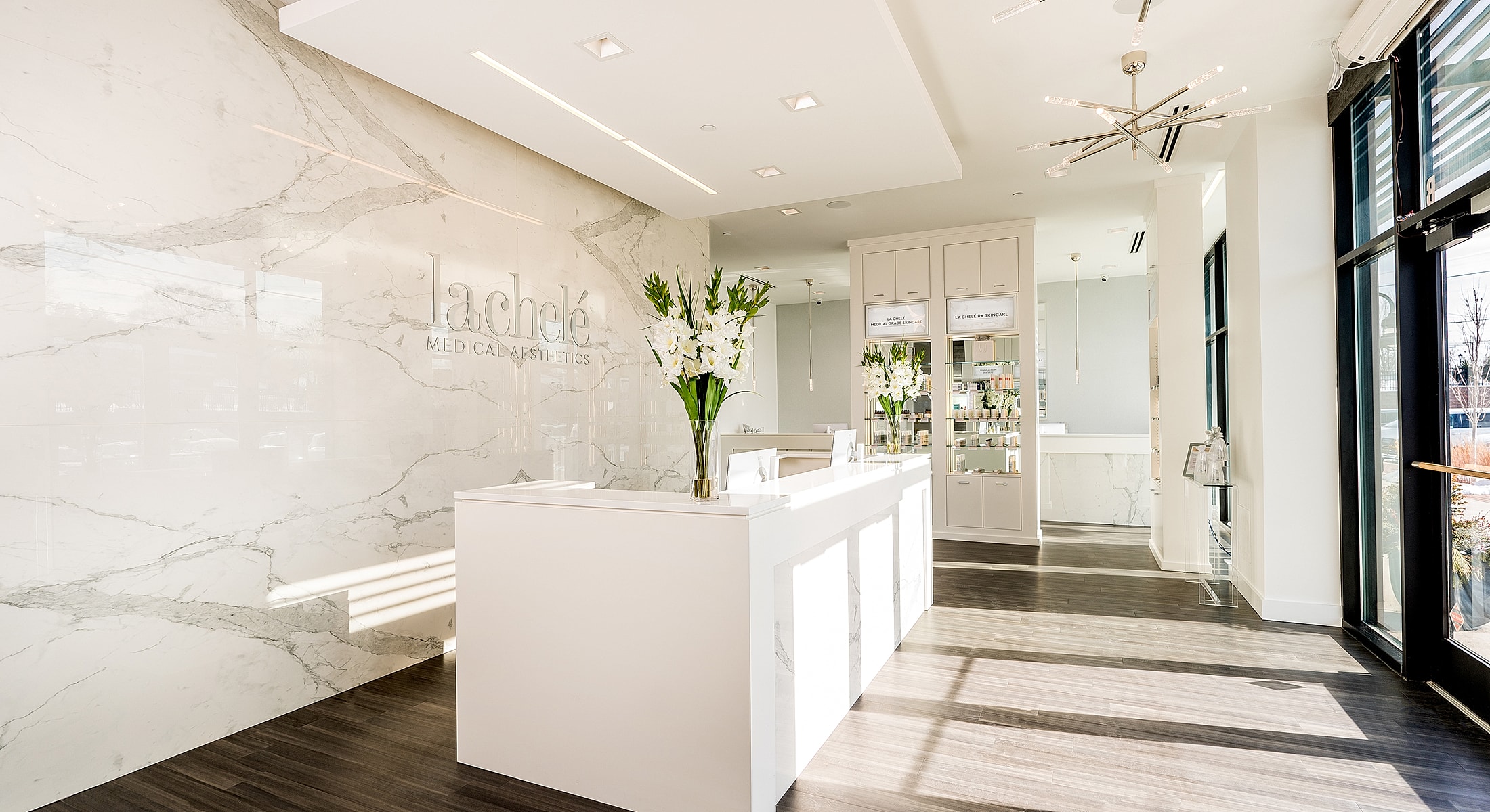 Modern medical aesthetics clinic interior with flowers.