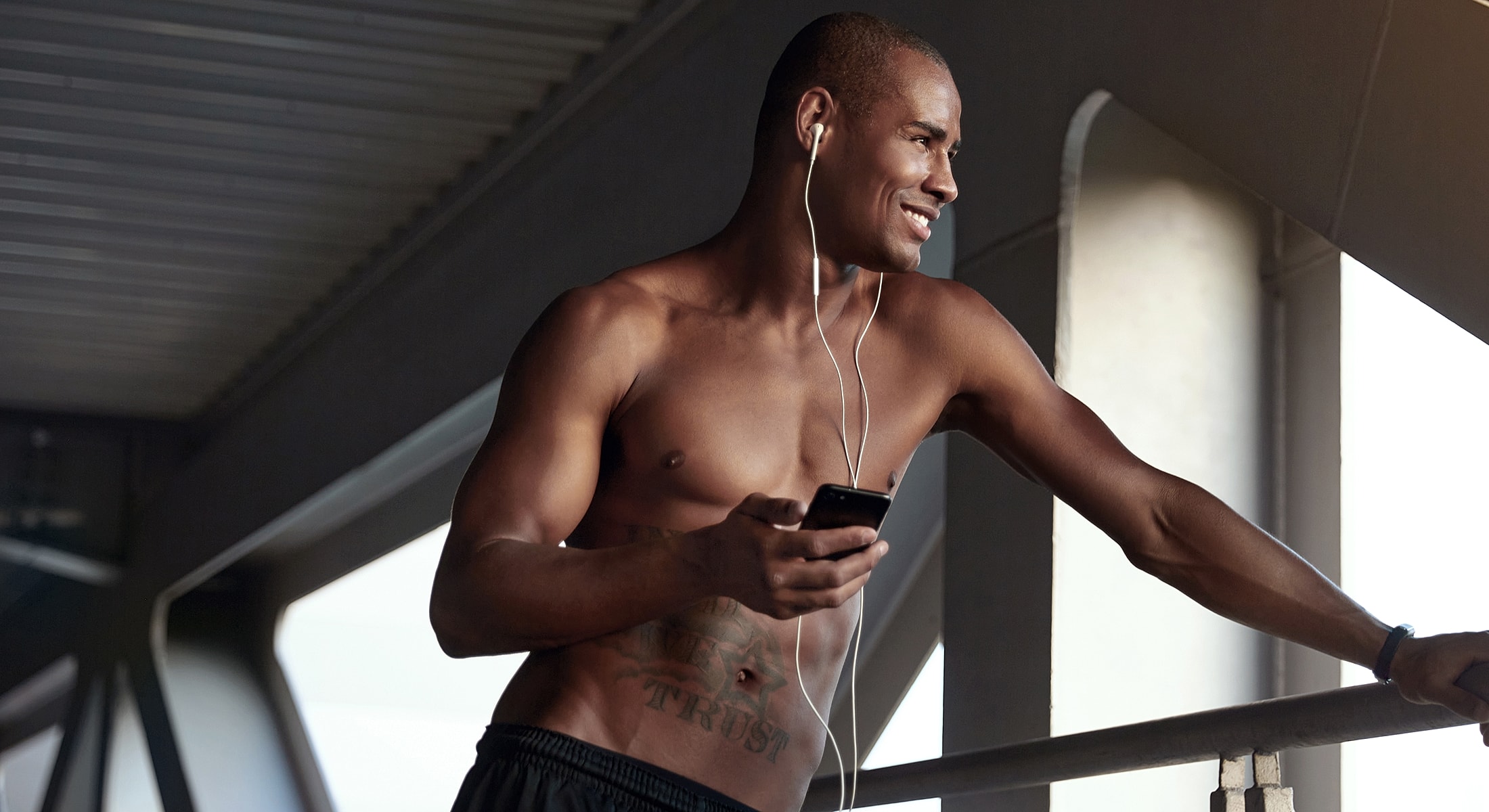 Man listening to music while standing outdoors.