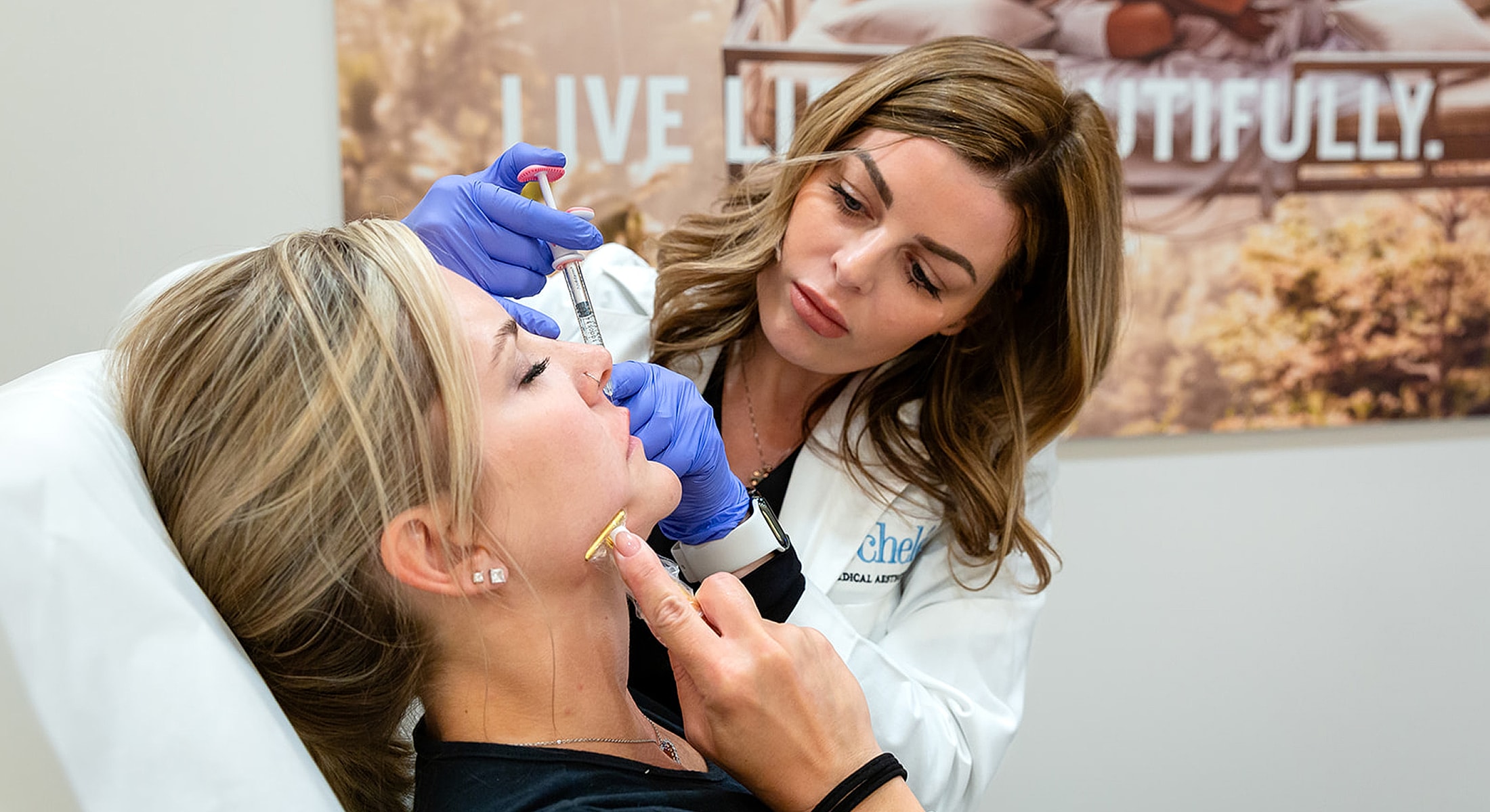 Woman receiving cosmetic treatment in medical setting.
