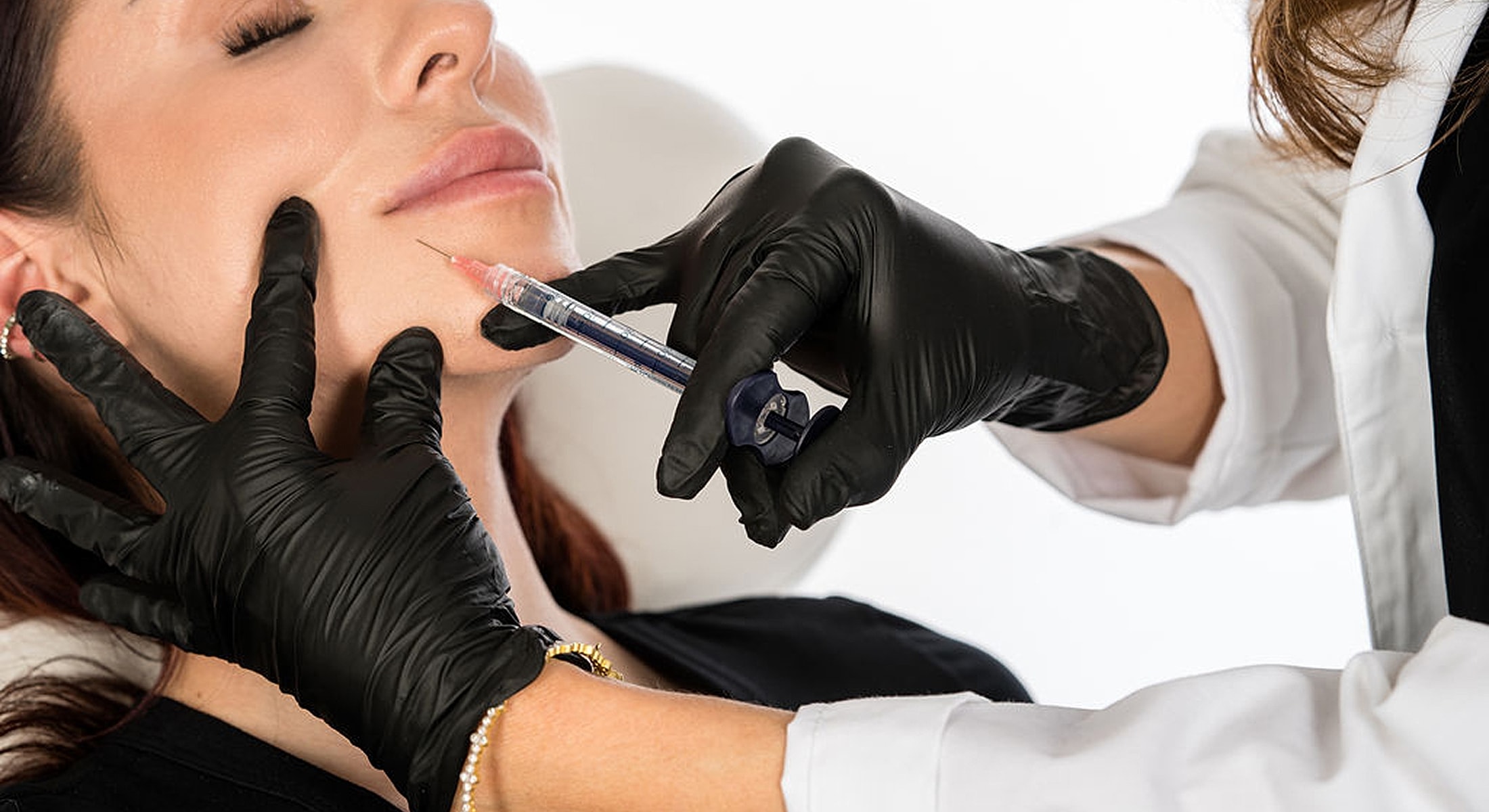 Injection procedure on a woman's face.