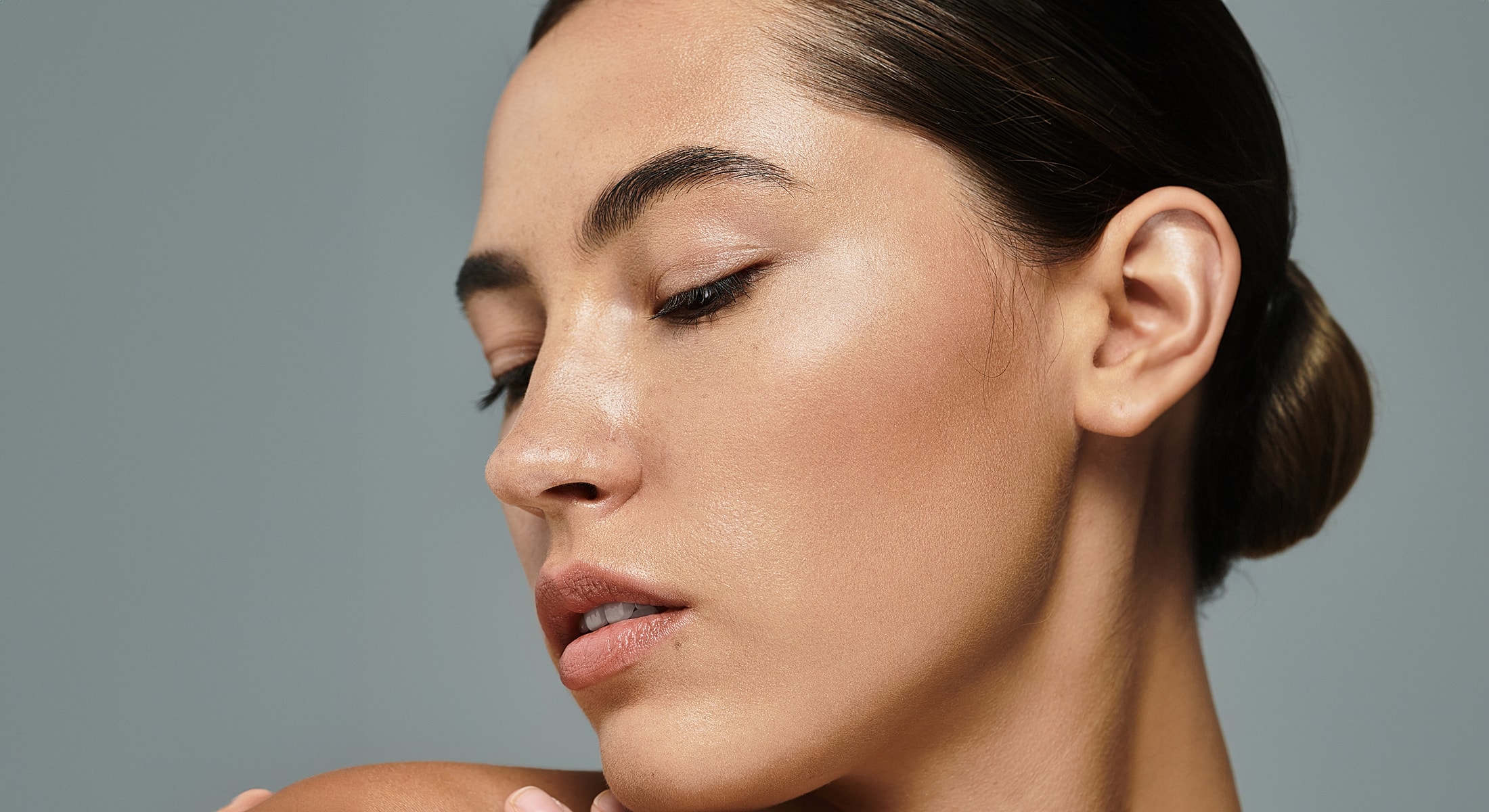 Close-up of a woman’s face with natural makeup.