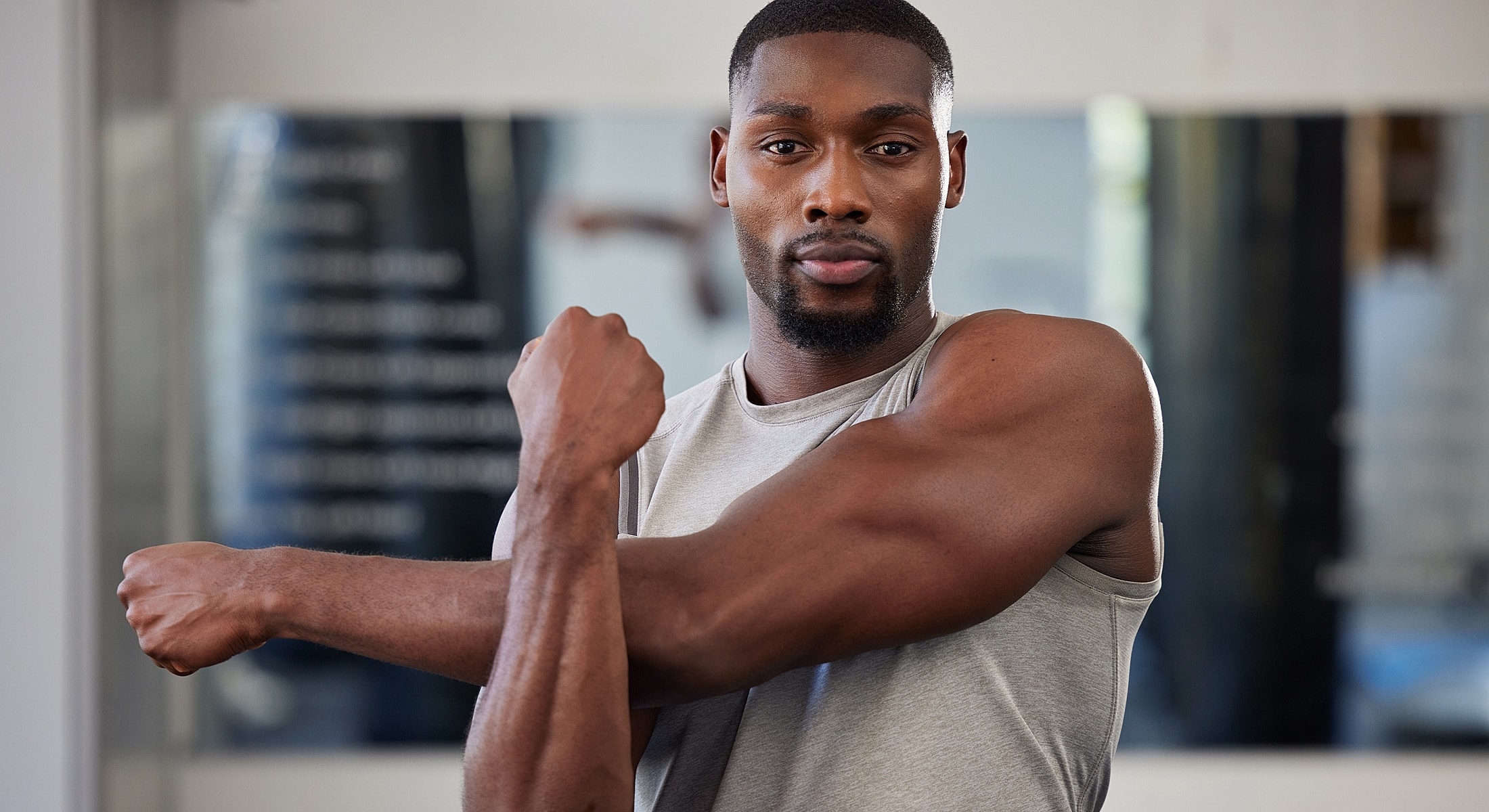 Person jogging on an empty road at sunset.
